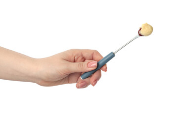 Tasty fondue. Woman holding fork with grape and melted cheese on white background, closeup