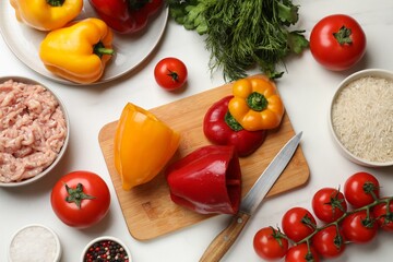 Making stuffed peppers. Vegetables and ground meat on white marble table, flat lay