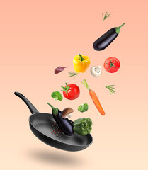 Frying pan and different vegetables in air on red gradient background