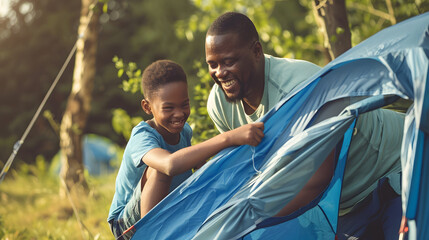 Happy african american son and father pitching tent together in sunny garden summer childhood fatherhood free time camping togetherness and outdoor activities unaltered : Generative AI