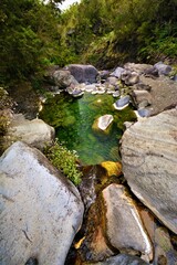 A picturesque pool hidden in the rocky landscape of the Cirque de Cilaos (a caldera on Reunion...