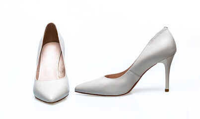 Beauty and fashion concept. Fashionable women shoes isolated on white background. Pair of white high heeled shoes. White high heel women shoes on white background. White shoe for women