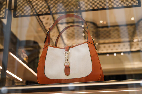 Milan, Italy - 24.04.2024: Gucci Cleo bag showcase at shopping gallery in the center of Milan, Galleria Vittorio Emanuele, vitrine of the clothes shop