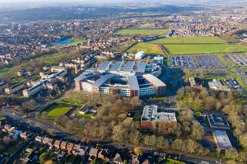 Aerial drone photo of main building of the Pinderfields Hospital, located in Wakefield West Yorkshire in the UK showing a Birds Eye view of the hospital grounds and car park in the winter time