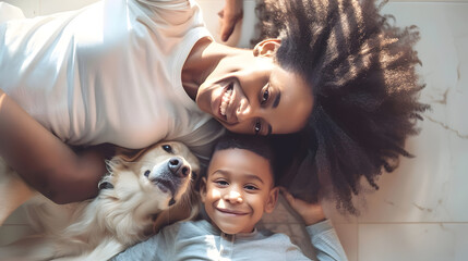 Happy african american mother and son lying on floor with their pet dog motherhood childhood togetherness pets and domestic life unaltered : Generative AI