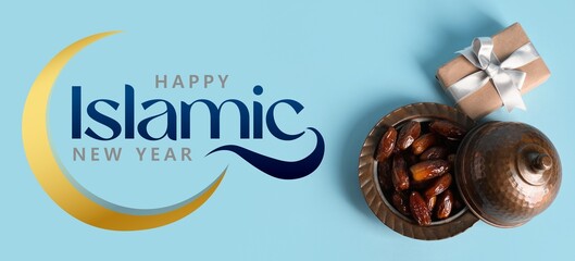Gift box and bowl with dried dates on blue background. Greeting banner for Islamic New Year
