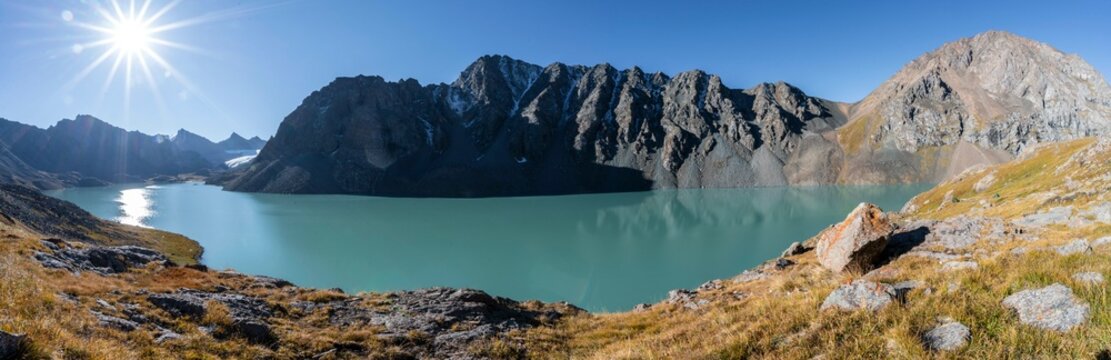 Panorama, Mountain landscape at the turquoise Ala Kul mountain lake in the morning light, Sun Star, Tien Shan Mountains, Kyrgyzstan, Asia