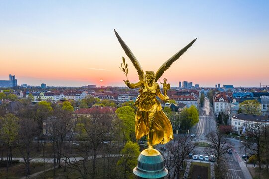 Golden Angel of Peace at sunrise, Peace Memorial, View of Prinzregentenstrasse and Bogenhausen, Drone shot, Munich, Upper Bavaria, Bavaria, Germany, Europe