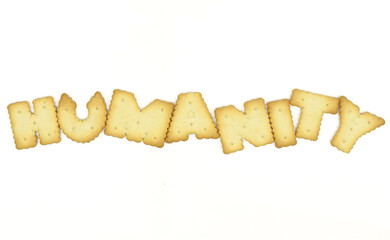 Capital letter shaped biscuits forming word HUMANITY isolated on white background