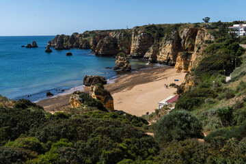 Praia de Dona Ana beach near Lagos town, Algarve, Portugal. Praia Dona Ana beach with turquoise sea water and cliffs, Portugal.