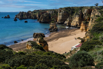 Praia de Dona Ana beach near Lagos town, Algarve, Portugal. Praia Dona Ana beach with turquoise sea water and cliffs, Portugal.
