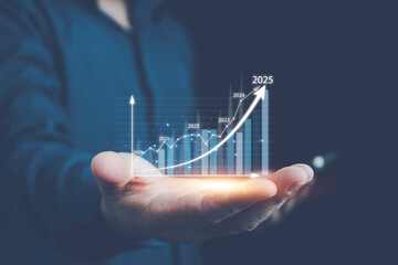 2025 business growth, Businessman holding growth graph a year 2025 of business and data analysis....