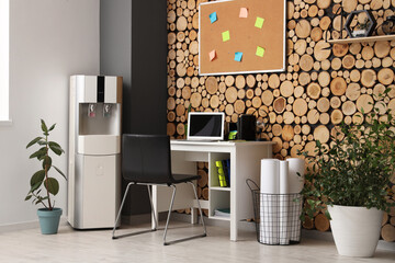 Interior of stylish office with modern water cooler