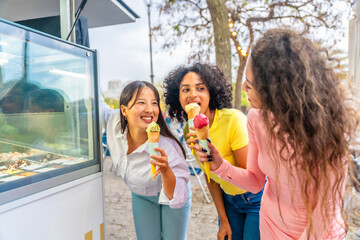 Happy childish woman eating ice cream in the street