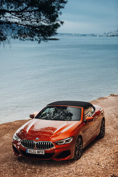 BMW 8 series G14 convertible at the parking of a sea shore 