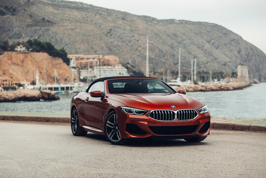 BMW 8 series G14 convertible at the parking of a sea shore 