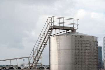 grain silos with stair on a cloudy day