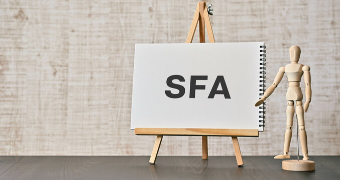There is notebook with the word SFA. It is an abbreviation for Sales Force Automation as eye-catching image.