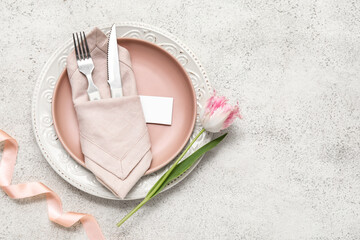 Stylish table setting with beautiful tulip on white background