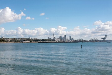Sky Tower of Auckland city, skyline on a sunny day, New Zealand, may 2024,