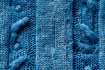 A close up of a blue knitted sweater