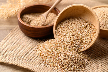 Brown quinoa seed in wooden bowl, Healthy food ingredient