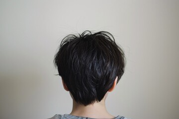 Haircut in Progress: A Close-Up View of the Back of a Person's Head