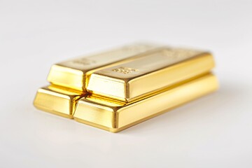 A Stack of Gold Bars on a White Surface