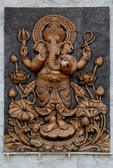 Closeup of The statue of the Ganesha on the wall of the temple in Bangkok, Thailand.