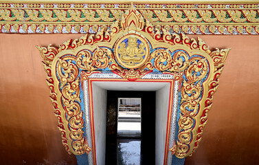 Thai style buddhism temple doors and windows of Thai Buddhist Temple in Bangkok, Thailand