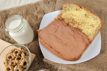 Bread with choco powder and butter on a plate for breakfast	
