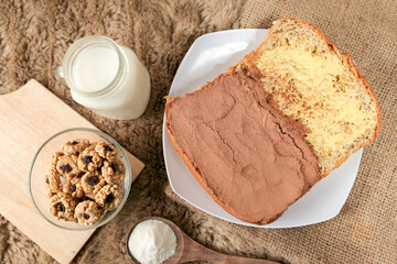 Bread with choco powder and butter on a plate for breakfast	
