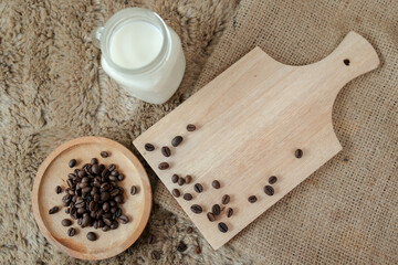 Delicious iced coffee, mocca, and chocolate drinks with coffee beans on white wooden table	
