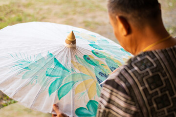 Making mulberry umbrellas to preserve culture and promote tourism using mulberry paper umbrellas as a representative and tourist souvenir in Bo Sang Village. Chiang Mai Province