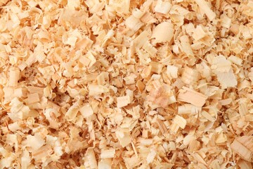 Pile of natural sawdust as background, top view