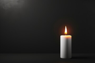 Burning candle on a dark background