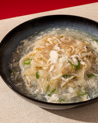 Typical Asian kwetiaw is served drizzled with spice sauce and egg