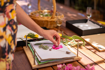 Artist pressing flowers