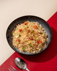 Fried rice is a dish of rice fried in a pan which produces a different taste because it is mixed with spices such as certain spices and sweet soy sauce.