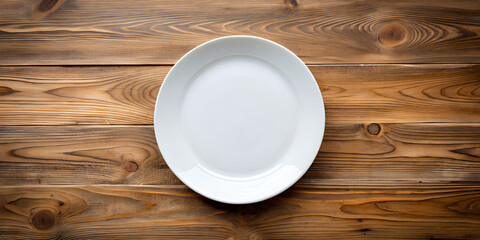 blank white food plate on a wood background with copy space