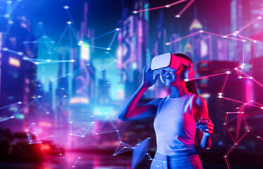 Female standing in cyberpunk style building in meta wear VR headset connecting metaverse, future...