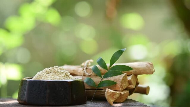 Eurycoma longifolia Jack tree ,powder and branch green leaves on natural  background.