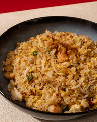 Seafood fried rice is a dish of rice fried in a pan which produces a different taste because it is mixed with spices and seafood.