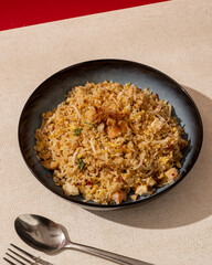 Seafood fried rice is a dish of rice fried in a pan which produces a different taste because it is mixed with spices and seafood.