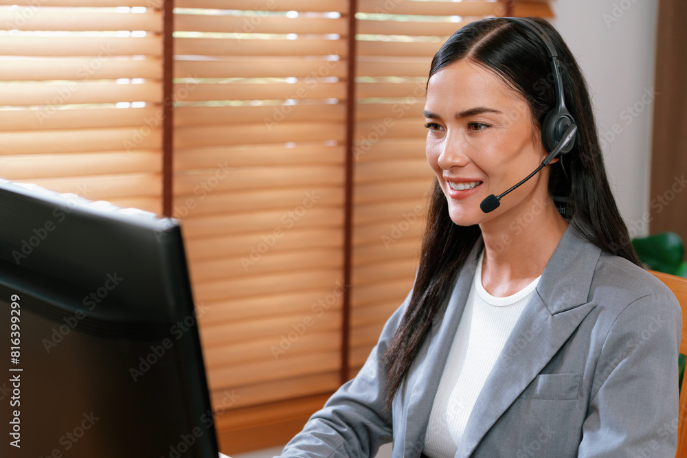 Aufkleber female call center operator or customer service helpdesk staff working on workspace while talking on