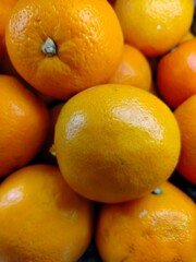 Lemon fruit. Stacked citrus fruits are sold at supermarkets. Sweet fruits are fresh and healthy.