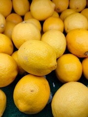 Lemon fruit. Stacked citrus fruits are sold at supermarkets. Sweet fruits are fresh and healthy.