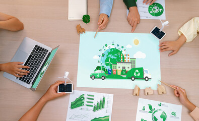 Eco city and waste management illustration placed on a meeting table during a green business...