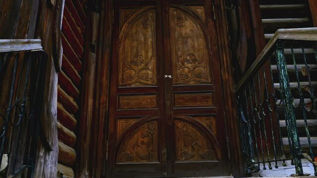 Details of russian traditional wooden architecture. Stock footage. Old wooden house decorated with carvings, ornament.