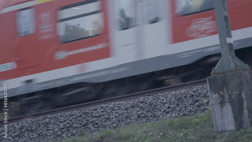 Poster blurred motion of a train passing swiftly over tracks, capturing the essence of speed and transit